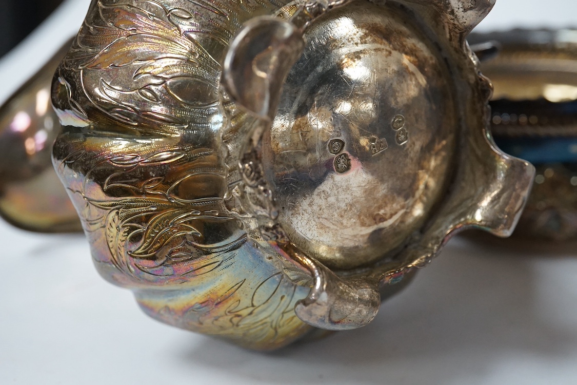 A George III engraved silver oval teapot, by John Eames, London, 1803, together with an early Victorian engraved silver milk jug, Edward Barton, London, 1837 and a late Victorian embossed silver sugar bowl by Josiah Will